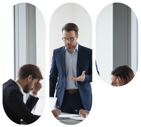 Manager addresses tense colleagues; two teammates hold heads during a troubled office meeting.